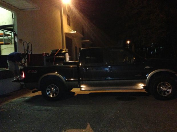 Yes, a washer, dryer, oven, microwave, and two pedestals will fit into an F250 in one shot
