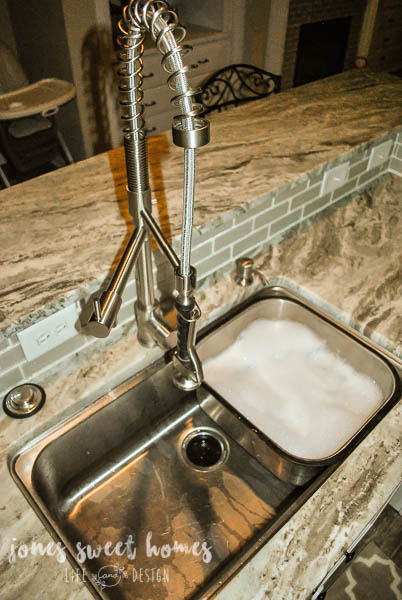 diy-kitchen-renovation-granite-white-cabinets-glass-backsplash-38